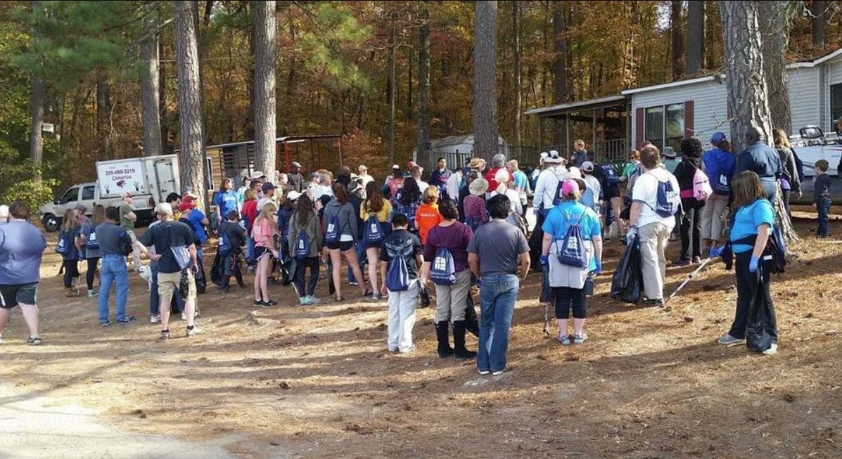 Volunteers gathered in the woods for the Lake Purdy cleanup